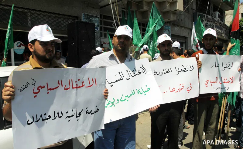 Palestinians take part a protest against political arrests by the security forces in the West Bank, Gaza City on July 11,2012. Photo by Naaman Omar
