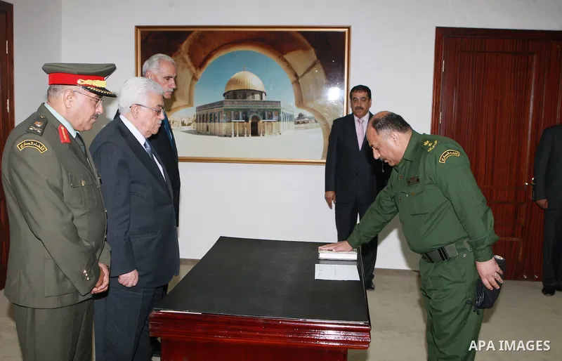 Palestinian judge Ahmed Abu Dayeh takes the oath of office to Palestinian President Mahmoud Abbas on his appointment as Deputy Military Prosecutor in the West Bank city of Ramallah on 11 July 2012. Photo by Thaer Ganaim