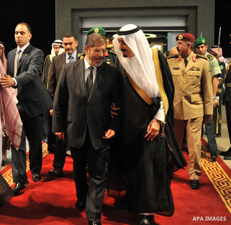 Egyptian President, Mohammed Morsi, center left, walks with Saudi Crown Prince Salman bin Abdulaziz Al Saud, center right, at the al-Salam palace in Jeddah, Saudi Arabia on uly 11, 2012. Morsi has said his administration...