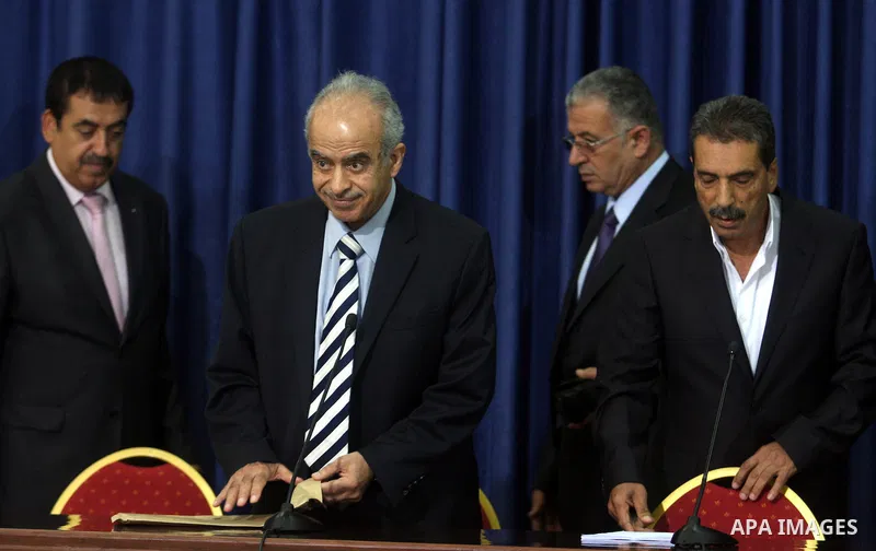 Palestinian Justice Minister Ali Mohanna, and one of late Yasser Arafat's doctors, Abdullah al-Bashir, hold a press conference with Palestinian official Tawfik Tirawi, in the West Bank city of Ramallah, Thursday, July, 1...