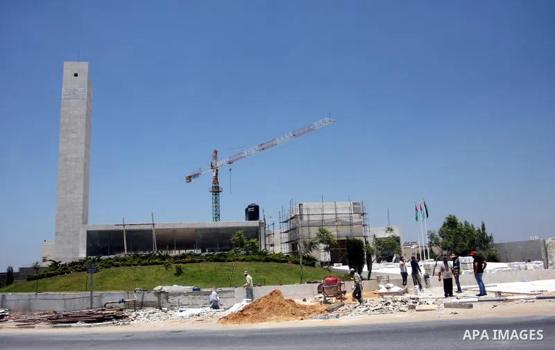 Workers walk outside the memorial building for the late Palestinian leader Yasser Arafat in the West Bank city of Ramallah on July, 12, 2012. Palestinian Justice Minister Ali Mohanna said Thursday investigators looking i...