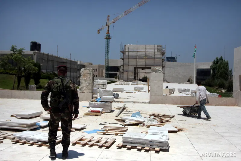 Workers walk outside the memorial building for the late Palestinian leader Yasser Arafat in the West Bank city of Ramallah on July, 12, 2012. Palestinian Justice Minister Ali Mohanna said Thursday investigators looking i...