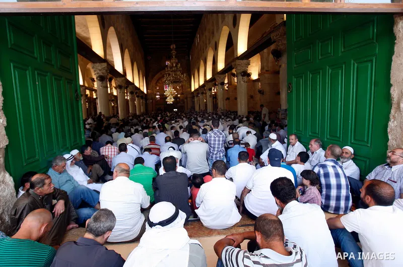 Palestinian Muslim worshippers participate Friday prayers, at the al-Aqsa Mosque compound, in Jerusalem's old city on July 13, 2012. Photo by Mahfouz Abu Turk