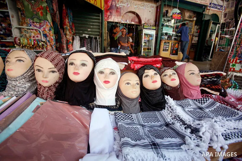A Palestinian vendor displays his goods following Friday prayers, in the old city of Jerusalem on July 13, 2012. Photo by Mahfouz Abu Turk