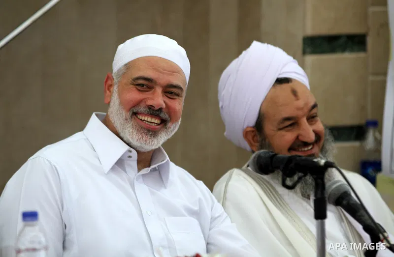 Palestinians listen to Palestinian Prime Minister in Gaza Ismail Haniyeh speech during Friday prayer in Gaza City on 13 July 2012. Photo by Majdi Fathi
