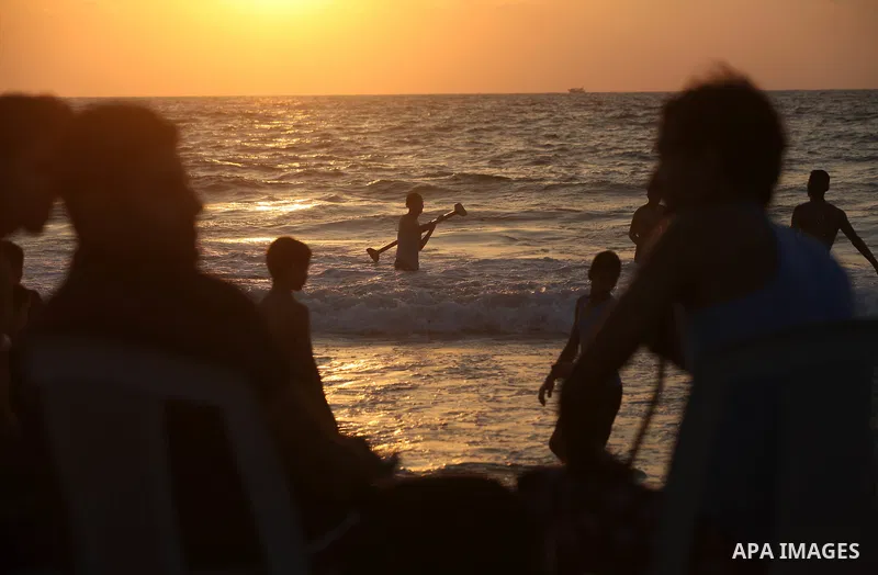Palestinians enjoy swimming in the sea at Gaza beach on 13 July 2012 in Gaza City. Photo by Majdi Fathi
