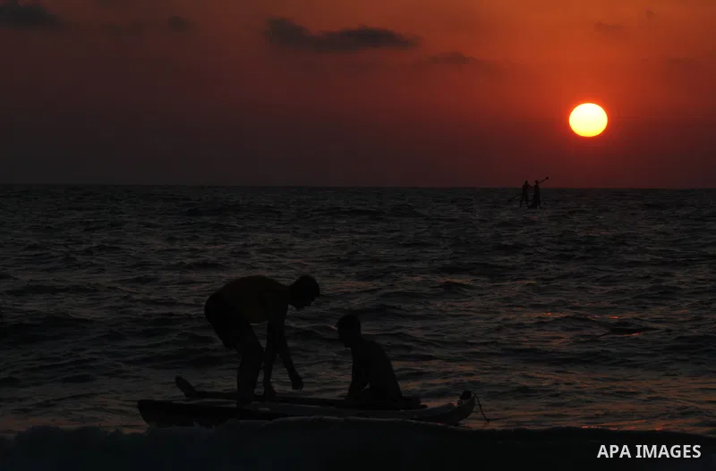 Palestinians enjoy swimming in the sea at Gaza beach on 13 July 2012 in Gaza City. Photo by Majdi Fathi