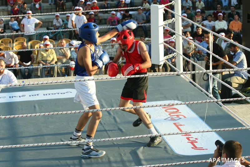 Palestinian boxing players fight during a friendly match in the West Bank city of Nablus, on 13 July 2012. Palestinian boxing union built a new international racetrack in Nablus. Photo by Nedal Eshtayah