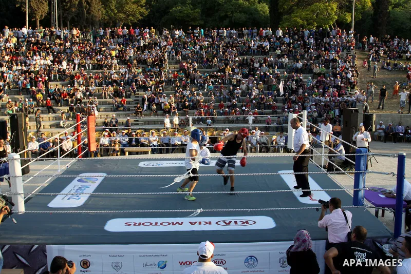 Palestinian boxing players fight during a friendly match in the West Bank city of Nablus, on 13 July 2012. Palestinian boxing union built a new international racetrack in Nablus. Photo by Nedal Eshtayah