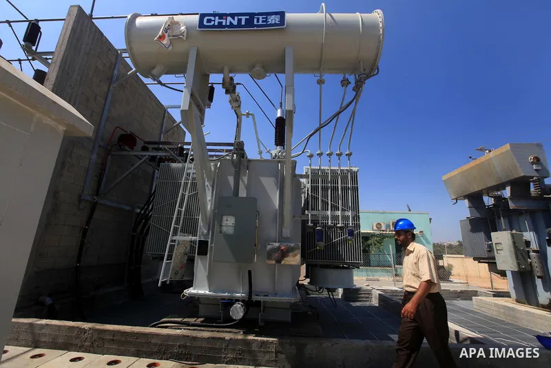 Palestinians workers work in energy company during maintenance work in Gaza city, on July 14, 2012. Photo by Majdi Fathi