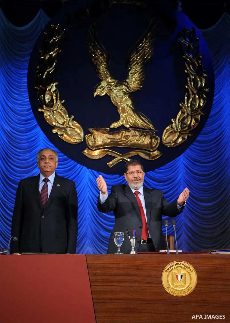 In this image released by the Egyptian Presidency, Egyptian President, Mohammed Morsi at a graduation ceremony at the Police Academy headquarters in Cairo, Egypt, July 14, 2012. The Police Academy was also the venue for...