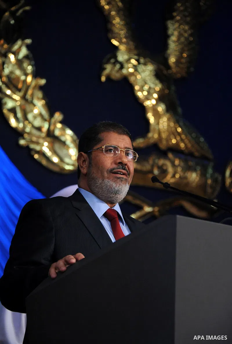 In this image released by the Egyptian Presidency, Egyptian President, Mohammed Morsi at a graduation ceremony at the Police Academy headquarters in Cairo, Egypt, July 14, 2012. The Police Academy was also the venue for...