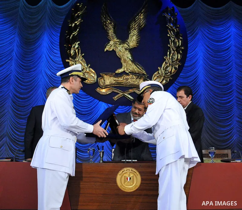 In this image released by the Egyptian Presidency, Egyptian President, Mohammed Morsi at a graduation ceremony at the Police Academy headquarters in Cairo, Egypt, July 14, 2012. The Police Academy was also the venue for...