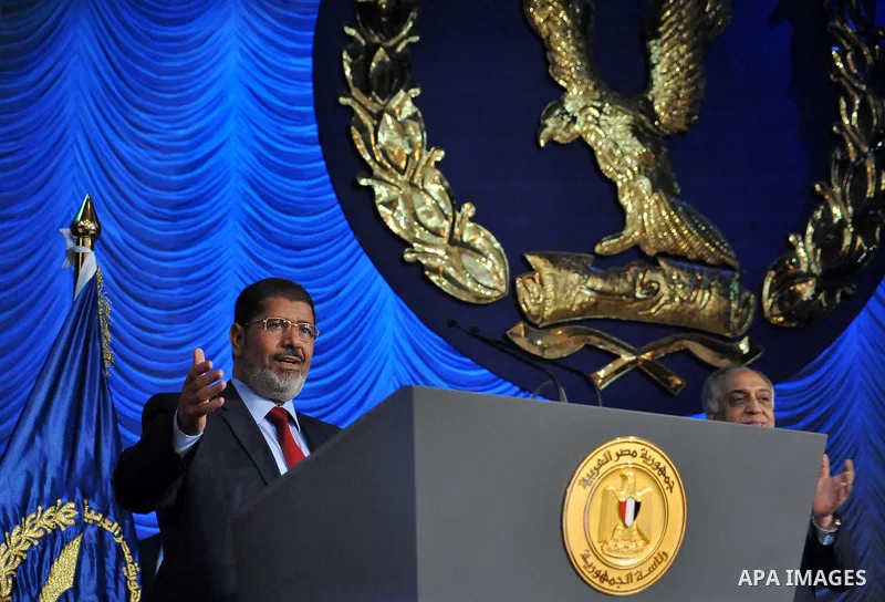 In this image released by the Egyptian Presidency, Egyptian President, Mohammed Morsi at a graduation ceremony at the Police Academy headquarters in Cairo, Egypt, July 14, 2012. The Police Academy was also the venue for...
