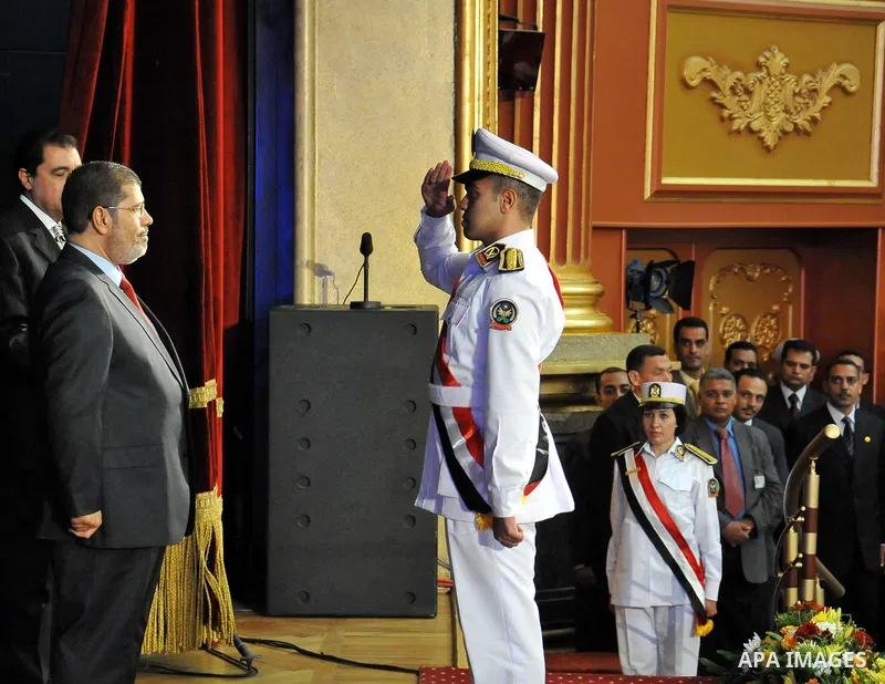In this image released by the Egyptian Presidency, Egyptian President, Mohammed Morsi at a graduation ceremony at the Police Academy headquarters in Cairo, Egypt, July 14, 2012. The Police Academy was also the venue for...