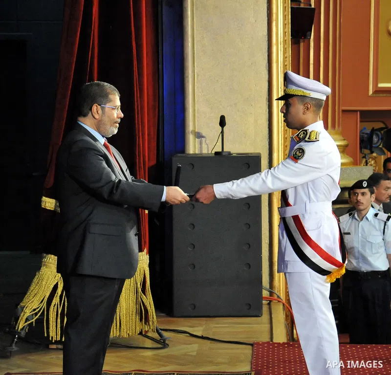 In this image released by the Egyptian Presidency, Egyptian President, Mohammed Morsi at a graduation ceremony at the Police Academy headquarters in Cairo, Egypt, July 14, 2012. The Police Academy was also the venue for...
