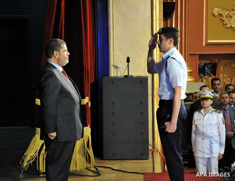 In this image released by the Egyptian Presidency, Egyptian President, Mohammed Morsi at a graduation ceremony at the Police Academy headquarters in Cairo, Egypt, July 14, 2012. The Police Academy was also the venue for...