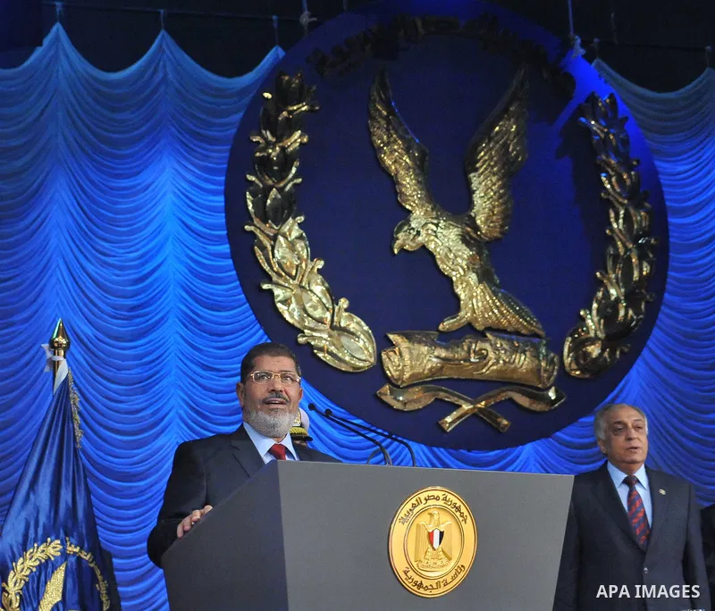 In this image released by the Egyptian Presidency, Egyptian President, Mohammed Morsi at a graduation ceremony at the Police Academy headquarters in Cairo, Egypt, July 14, 2012. The Police Academy was also the venue for...