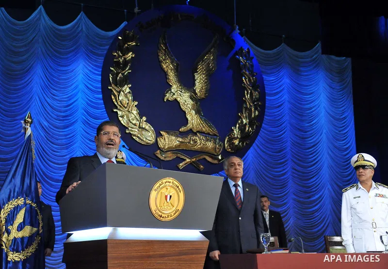 In this image released by the Egyptian Presidency, Egyptian President, Mohammed Morsi at a graduation ceremony at the Police Academy headquarters in Cairo, Egypt, July 14, 2012. The Police Academy was also the venue for...