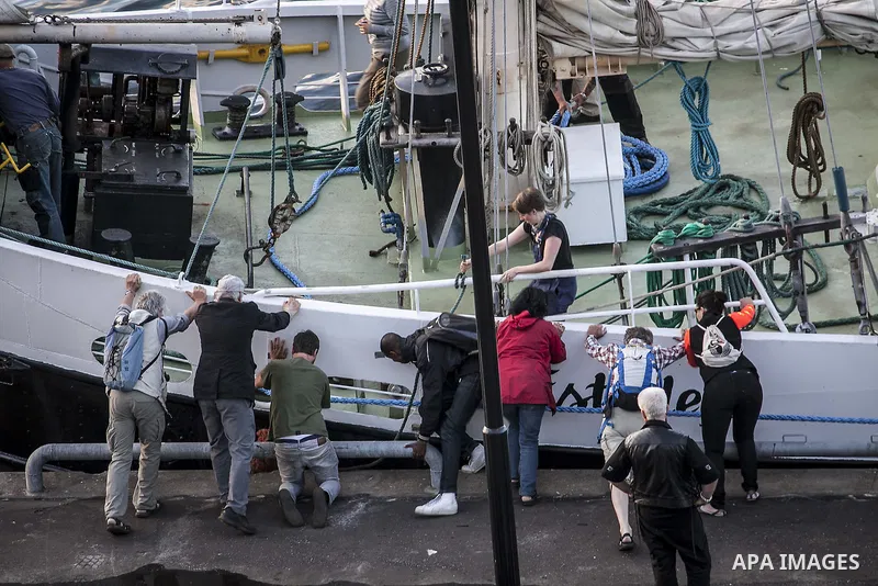 July 13, 2012 - Stockholm, Stockholm, Sweden - A group of pro-Palestinian supporters help to set sail to the humanitarian aid ship aiming at Gaza strip in the Skeppsbron port, Stockholm. The ship is part of a pro-palesti...