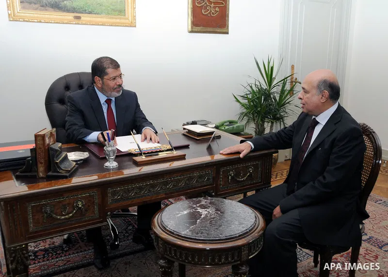 Egypt's president Mohamed Mursi, meets with ambassador Mohamed Refaah El Tahtawy at the presidential palace in Cairo, July 14, 2012. Photo by apaimages/Egyptian Presidency/Mohamed Abd el Moaty