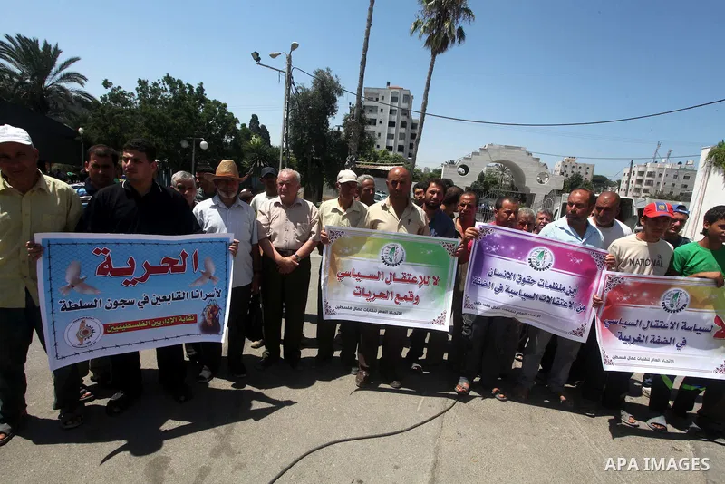 Palestinian trade unions and members legislative council participate a protest against political arrests by the security forces in the West Bank, Gaza City on July 15, 2012. Photo by Ashraf Amra