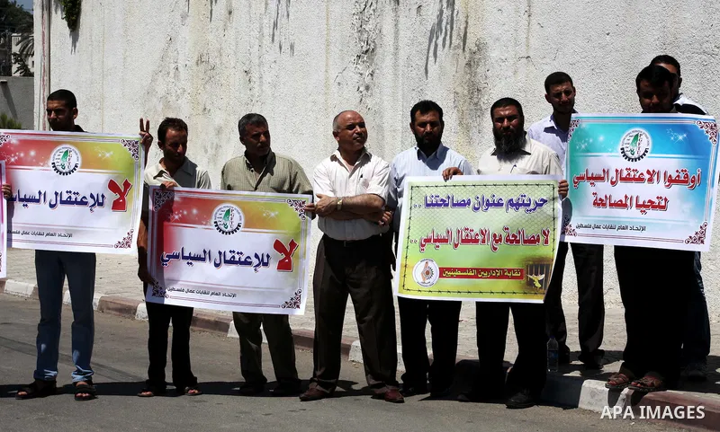 Palestinian trade unions and members legislative council participate a protest against political arrests by the security forces in the West Bank, Gaza City on July 15, 2012. Photo by Ashraf Amra