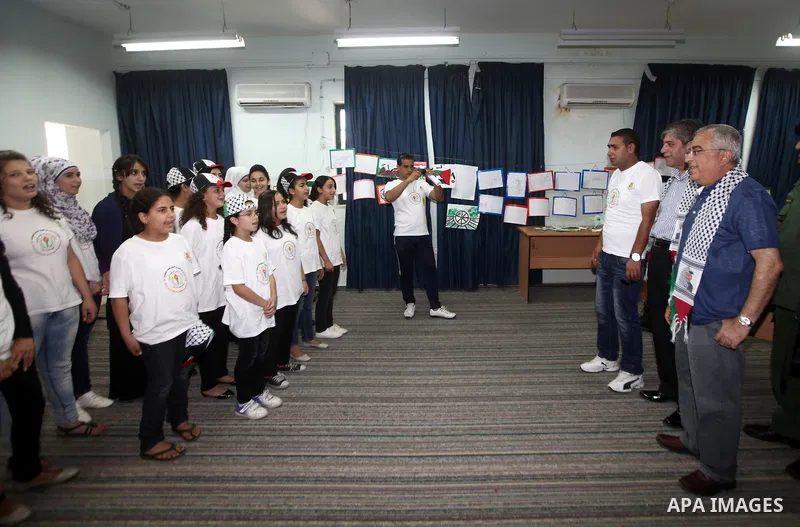 Palestinian Prime Minister Salam Fayyad visits "Palestine in sons of the martyrs eyes" summer camp, in the West Bank city of Jenin, al-Fari'ah refugee camp, on July 15, 2012. Photo by Mustafa Abu Dayeh