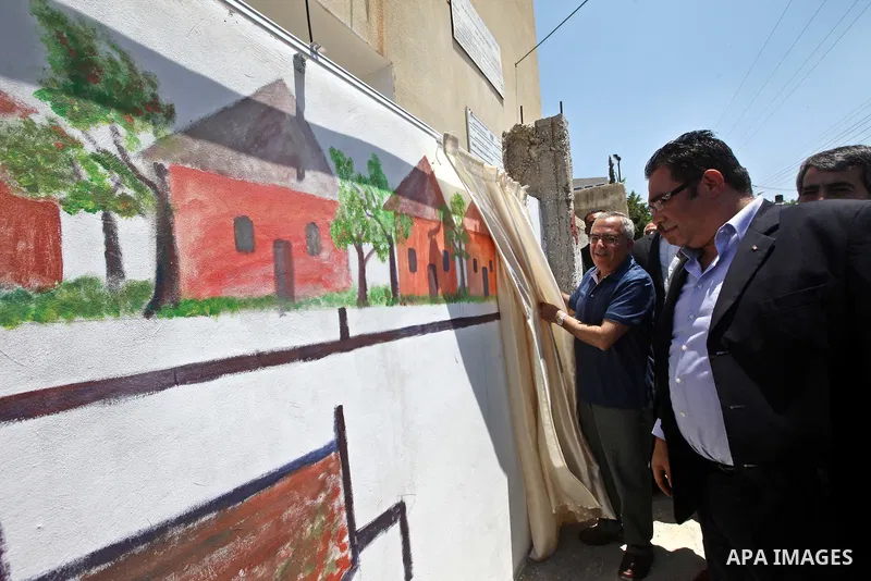 Palestinian Prime Minister Salam Fayyad attends the closing ceremony of "Protection of the Environment" summer camp, organised by Palestinian Water Authority in the West Bank, southern Nablus, village of Biddya, on July...