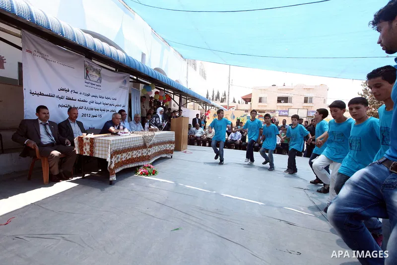 Palestinian Prime Minister Salam Fayyad attends the closing ceremony of "Protection of the Environment" summer camp, organised by Palestinian Water Authority in the West Bank, southern Nablus, village of Biddya, on July...