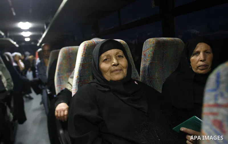 Family members of Palestinian prisoners on their way to visit their relatives jailed in Israel sit in a bus before it leaves Gaza City July 16, 2012. Israel on Monday allowed Palestinian families from the Gaza Strip to v...