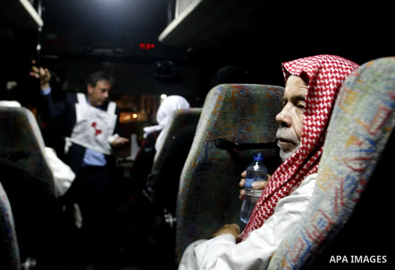 Family members of Palestinian prisoners on their way to visit their relatives jailed in Israel sit in a bus before it leaves Gaza City July 16, 2012. Israel on Monday allowed Palestinian families from the Gaza Strip to v...