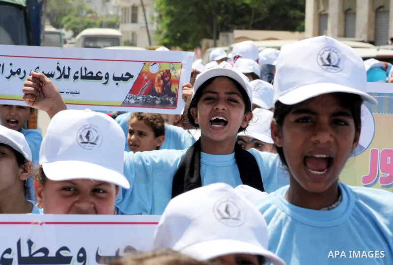 Palestinian children demonstrate during a protest calling for the release of prisoners held in Israeli jails in front of the headquarters Red Cross in Gaza City, on July.16, 2012. Photo by Ashraf Amra