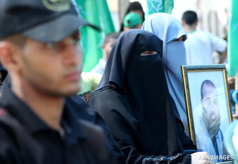 Palestinian relatives prisoners attend a protest calling for the release of their sons held in Israeli jails in front of the headquarters Red Cross in Gaza City, Gaza Strip, on July.16, 2012. Photo by Ashraf Amra