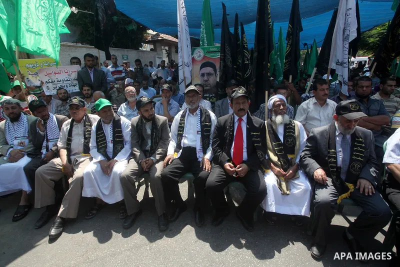 Palestinian relatives prisoners attend a protest calling for the release of their sons held in Israeli jails in front of the headquarters Red Cross in Gaza City, Gaza Strip, on July.16, 2012. Photo by Ashraf Amra