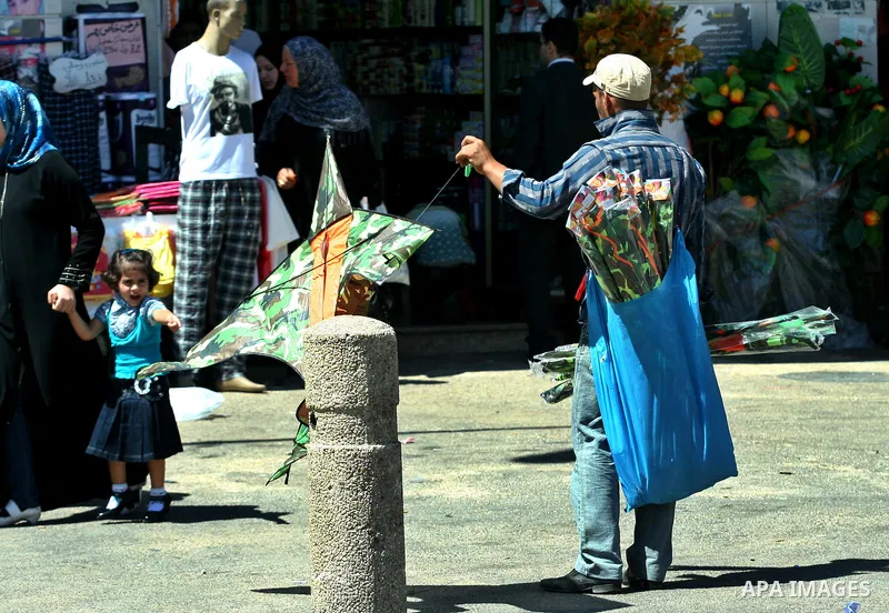 A Palestinian vendor sells kites in the street in the West Bank city of Nablus, on July 17, 2012. Photo by Nedal Eshtayah