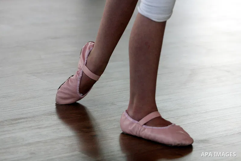A Palestinian girl practises finger movements during a ballet class at the Ramallah Ballet Center dance school in the West Bank city of Ramallah July 17, 2012. The center is the first in the occupied West Bank. Picture t...