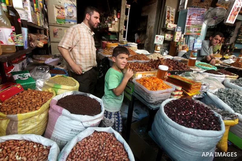 A Palestinian vendor displays goods in preparation for the holy month of Ramadan in the Gaza city on July 17, 2012 . Islam's holy month of Ramadan will begin in few days depending on the sighting of the crescent moon. Mu...