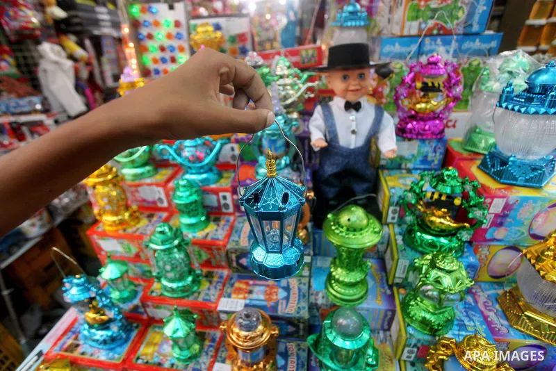 A Palestinian vendor displays goods in preparation for the holy month of Ramadan in the Gaza city on July 17, 2012 . Islam's holy month of Ramadan will begin in few days depending on the sighting of the crescent moon. Mu...