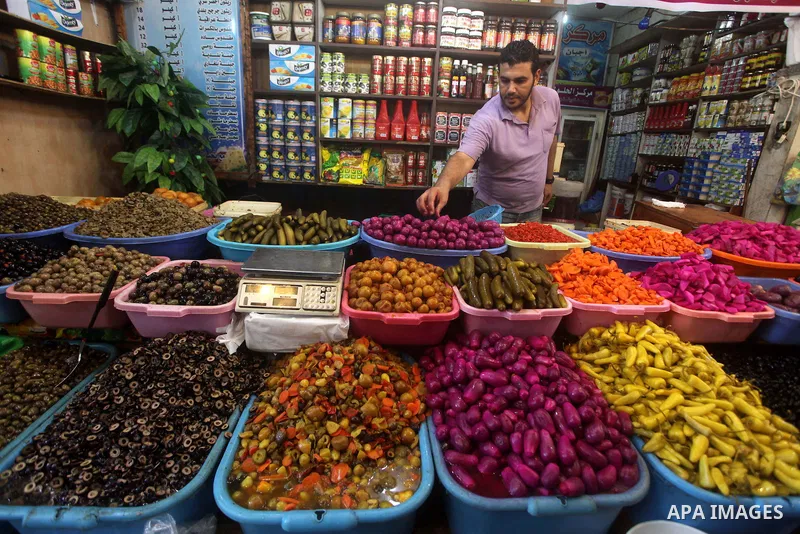 A Palestinian vendor displays goods in preparation for the holy month of Ramadan in the Gaza city on July 17, 2012 . Islam's holy month of Ramadan will begin in few days depending on the sighting of the crescent moon. Mu...