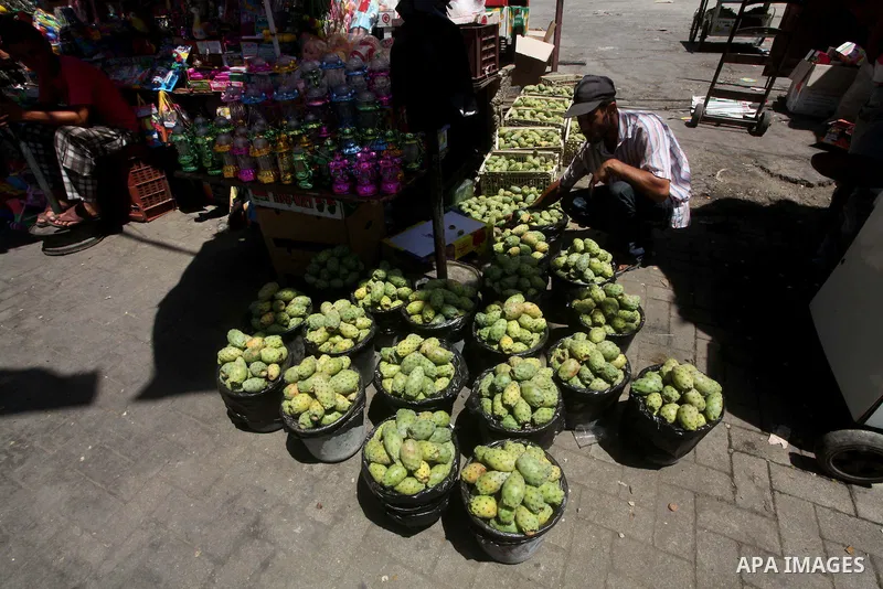 A Palestinian vendor displays goods in preparation for the holy month of Ramadan in the Gaza city on July 17, 2012 . Islam's holy month of Ramadan will begin in few days depending on the sighting of the crescent moon. Mu...