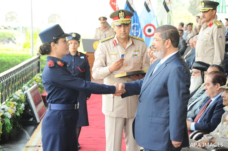 Egyptian President Mohamed Morsi honoring a military cadet during a medal ceremony for graduates at the Egyptian Military Academy in Cairo July 17, 2012. Fadi Fares / Egyptian Presidency