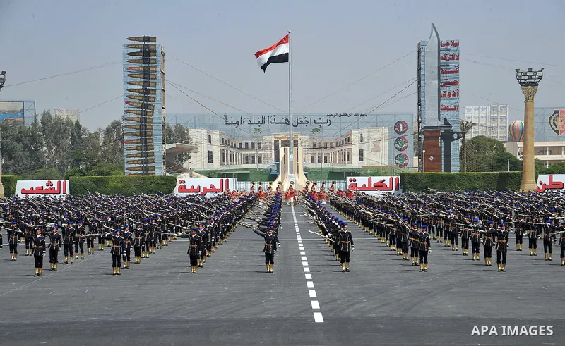 Egyptian troops demonstrate their skills at a graduation ceremony attended by President Mohammed Morsi, unseen, in Cairo, Egypt, Tuesday, July 17, 2012. Egypt's President Mohammed Morsi hailed the Egyptian army and its c...