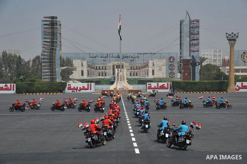 Egyptian troops demonstrate their skills at a graduation ceremony attended by President Mohammed Morsi, unseen, in Cairo, Egypt, Tuesday, July 17, 2012. Egypt's President Mohammed Morsi hailed the Egyptian army and its c...