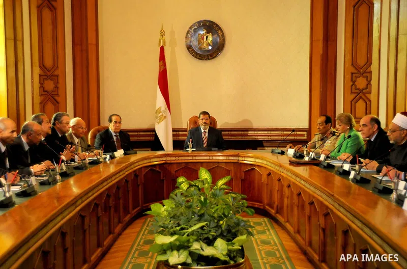 Egyptian President Mohamed Morsi (C) attends meeting with council of ministers in Cairo on July 18, 2012. Mohammed Smaha / Egyptian Presidency