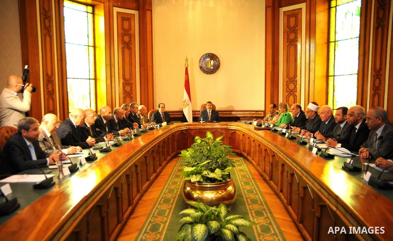 Egyptian President Mohamed Morsi (C) attends meeting with council of ministers in Cairo on July 18, 2012. Mohammed Smaha / Egyptian Presidency