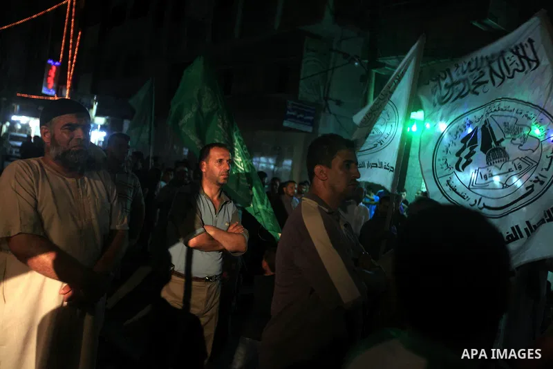 Palestinians Hamas movement supporters hold up banners during a rally in Gaza city, on 18 July 2012. Protesters demand Palestinian President Mahmoud Abbas and Egypt's President Mohamed Morsi to fix electricity crisis in...
