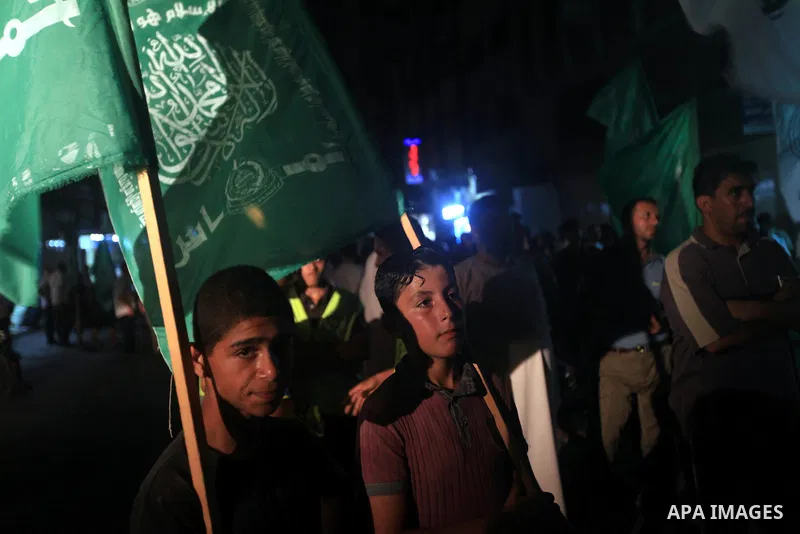 Palestinians Hamas movement supporters hold up banners during a rally in Gaza city, on 18 July 2012. Protesters demand Palestinian President Mahmoud Abbas and Egypt's President Mohamed Morsi to fix electricity crisis in...