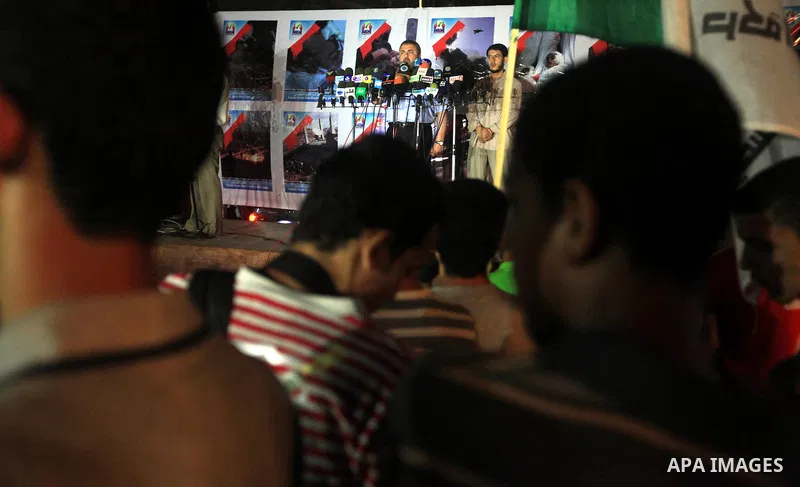Palestinians Hamas movement supporters hold up banners during a rally in Gaza city, on 18 July 2012. Protesters demand Palestinian President Mahmoud Abbas and Egypt's President Mohamed Morsi to fix electricity crisis in...
