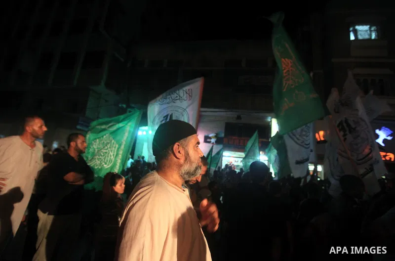 Palestinians Hamas movement supporters hold up banners during a rally in Gaza city, on 18 July 2012. Protesters demand Palestinian President Mahmoud Abbas and Egypt's President Mohamed Morsi to fix electricity crisis in...